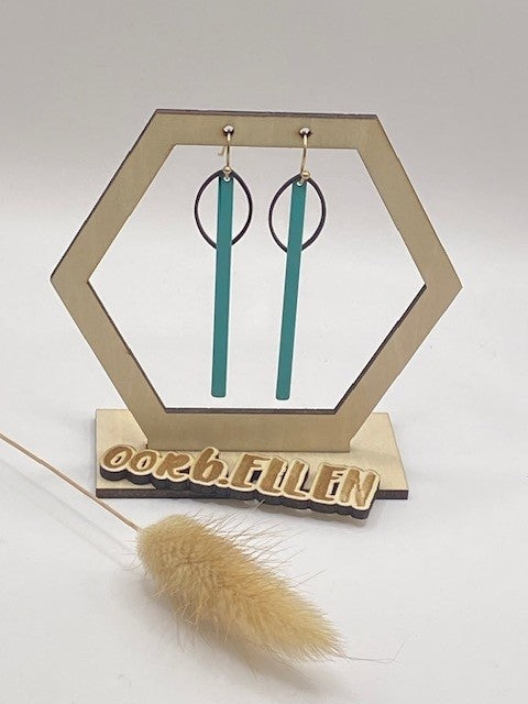 Zwarte ellipsen + lang turquoise staafje