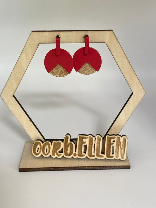 Gouden cirkel aan rood staafje met rode cirkel (met hap uit)