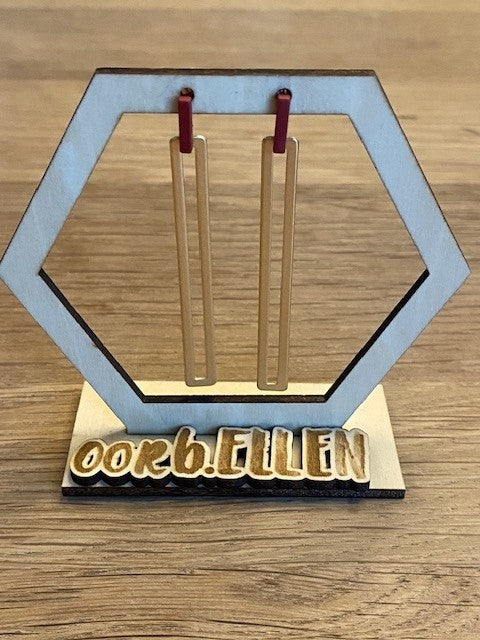 lange mat gouden staafjes met klein staafje donkere porto